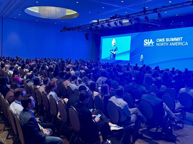 A large audience watching a speaker on the CWS Summit North America stage in 2025